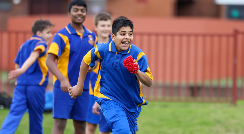 Patrician Brothers Catholic College Blacktown students running on field