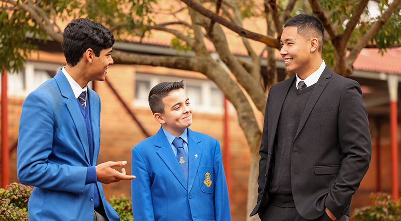 Teacher with students at Patrician Brothers Blacktown