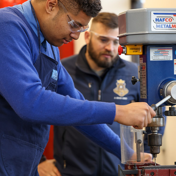 Patrician Brothers Catholic College Blacktown student with teacher in woodwork room