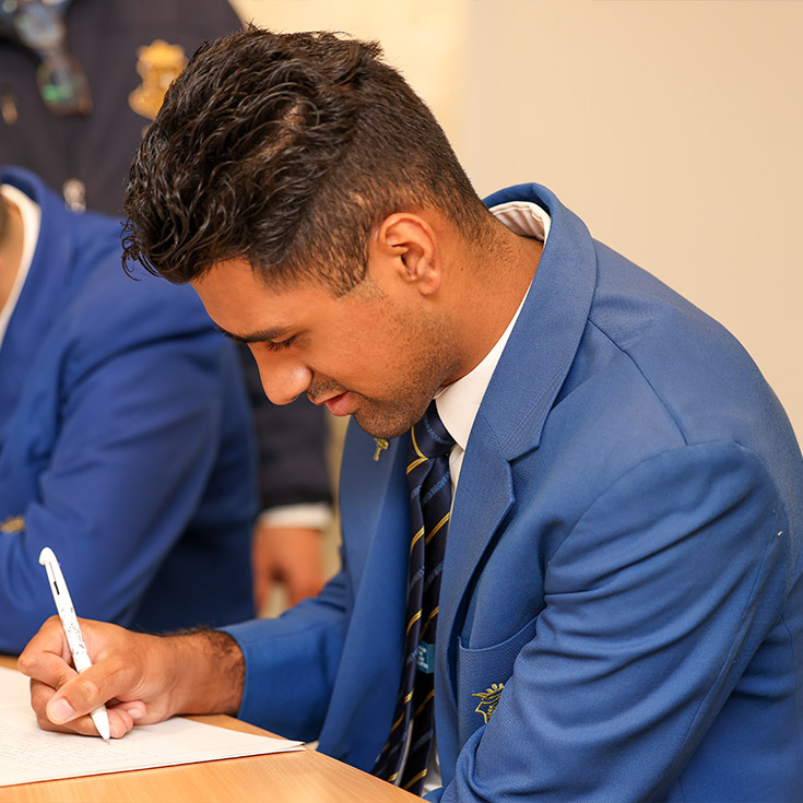 Patrician Brothers Catholic College Blacktown student writing on paper